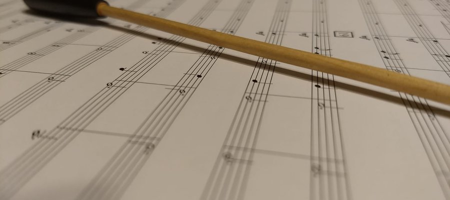 Sheet music and baton close up